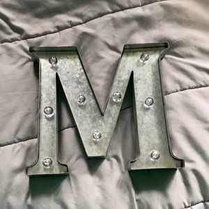 Light up “M” decoration.